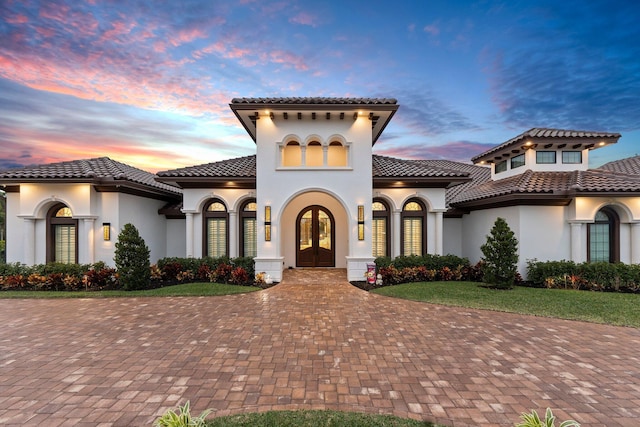 mediterranean / spanish-style home featuring french doors