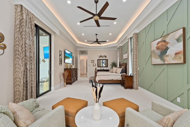 carpeted bedroom with ceiling fan, a tray ceiling, and access to exterior