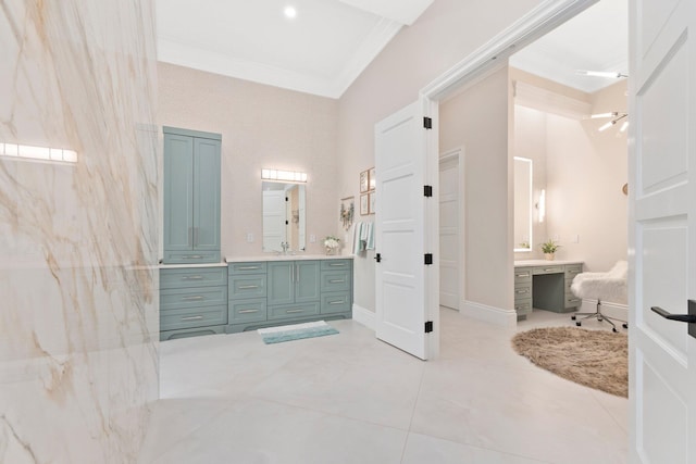 bathroom with vanity and ornamental molding