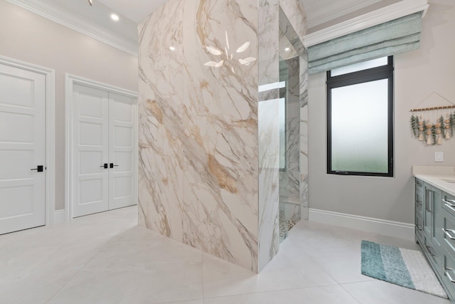 bathroom featuring ornamental molding, vanity, and a tile shower