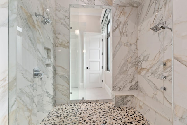 bathroom with a tile shower