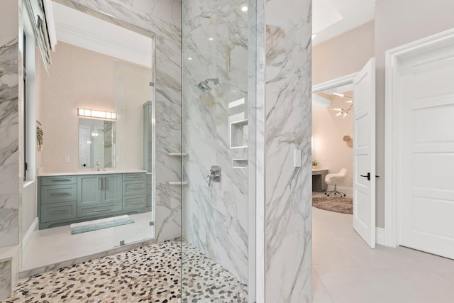 bathroom featuring vanity and tiled shower