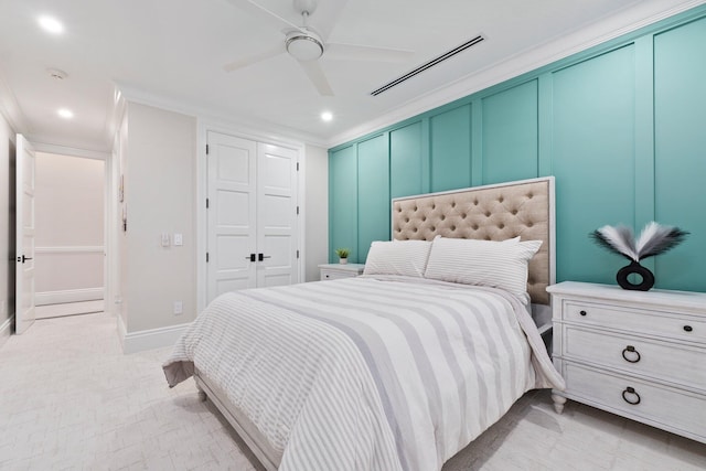 bedroom featuring ceiling fan and ornamental molding