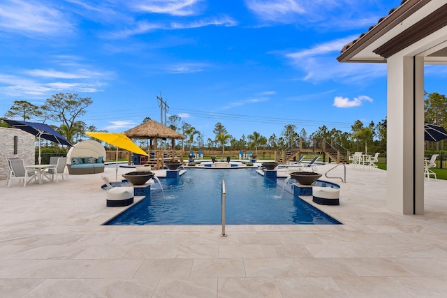 view of swimming pool featuring a gazebo, a patio, and pool water feature