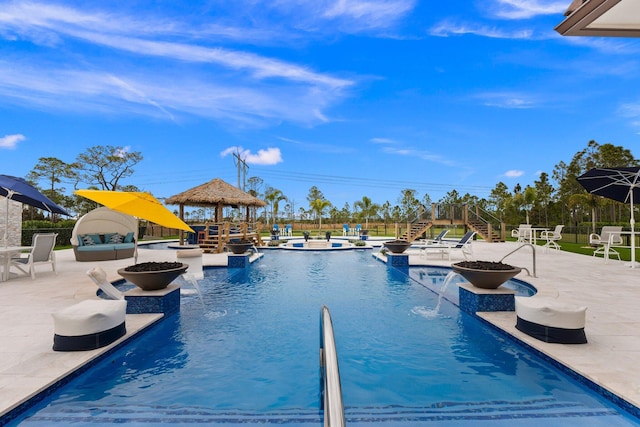 view of pool with a gazebo, pool water feature, and a patio area