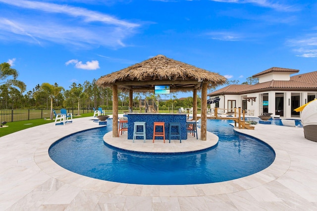 view of pool featuring a gazebo, an outdoor bar, and a patio