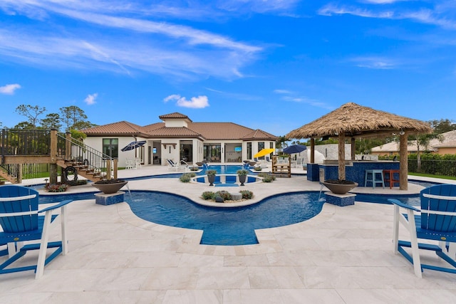 view of swimming pool with a patio and a gazebo