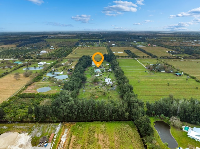 drone / aerial view with a water view and a rural view