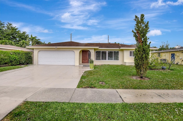 ranch-style home with a garage and a front lawn