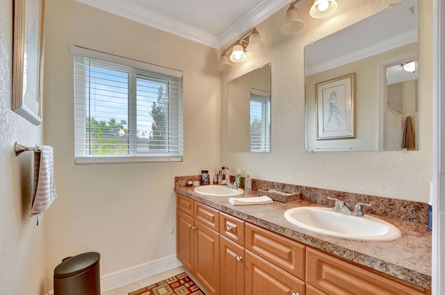 bathroom with crown molding, vanity, and tile patterned flooring