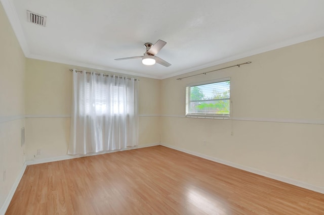 unfurnished room featuring crown molding, ceiling fan, and light hardwood / wood-style floors