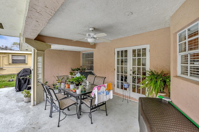 view of patio with ceiling fan and french doors