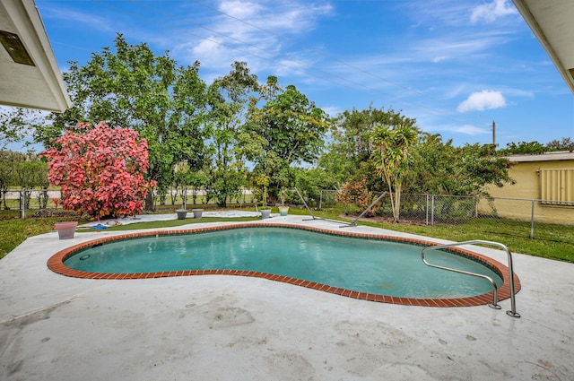 view of swimming pool featuring a patio