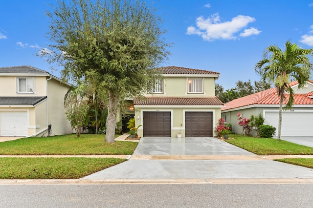 mediterranean / spanish-style home with a garage and a front yard