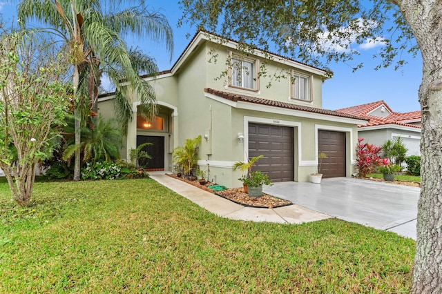 mediterranean / spanish home featuring a garage and a front yard