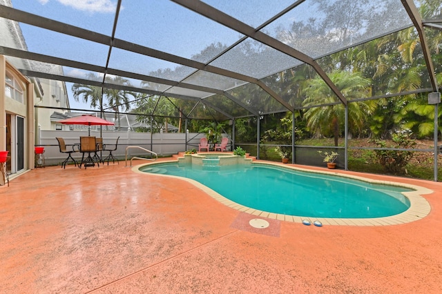 view of swimming pool featuring an in ground hot tub, a lanai, and a patio area