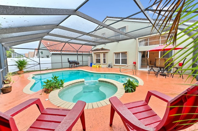 view of pool with an in ground hot tub, a lanai, grilling area, and a patio area