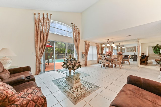 living room featuring an inviting chandelier and light tile patterned floors