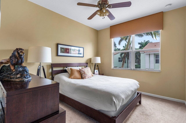 bedroom with light colored carpet and ceiling fan