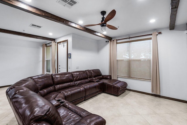 living room featuring beamed ceiling and ceiling fan