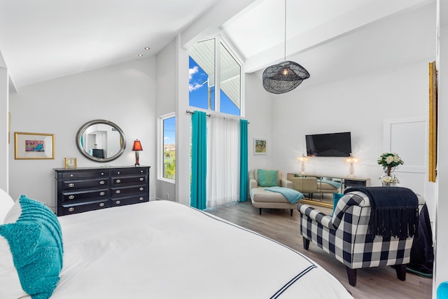 bedroom featuring high vaulted ceiling and wood-type flooring