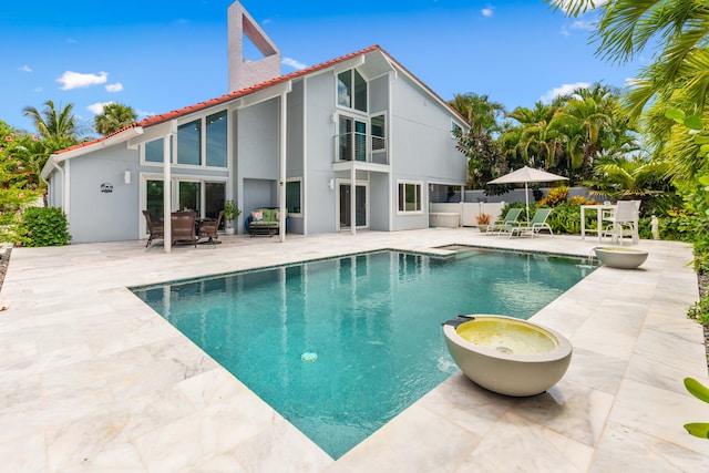 view of swimming pool with a patio area