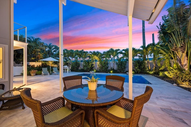 view of patio terrace at dusk