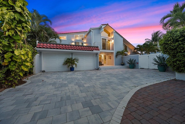 view of front of house with a balcony and a garage