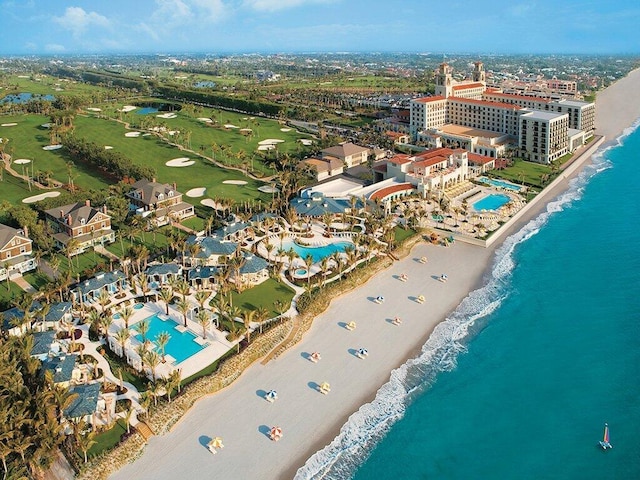 bird's eye view with a water view and a view of the beach