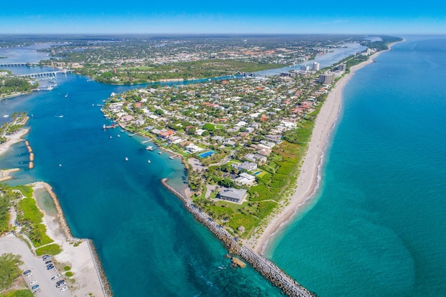 bird's eye view featuring a water view and a view of the beach