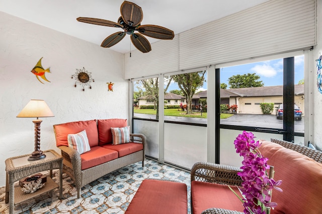 sunroom featuring ceiling fan