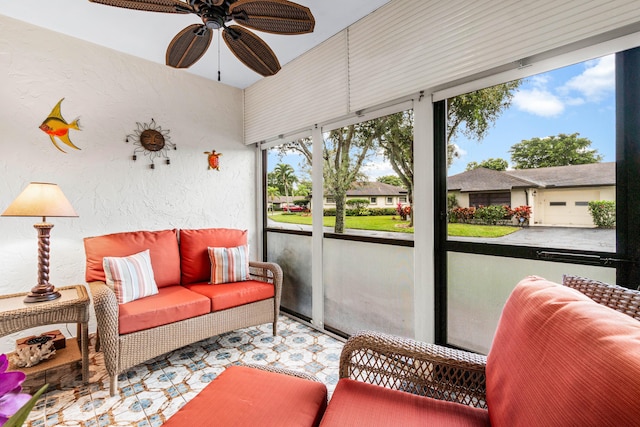 sunroom / solarium featuring ceiling fan