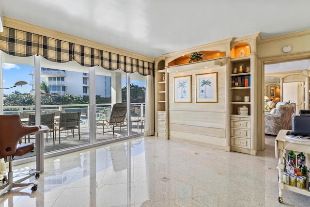 interior space featuring crown molding and built in features