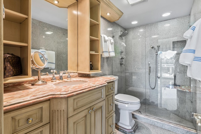 bathroom with vanity, an enclosed shower, and toilet