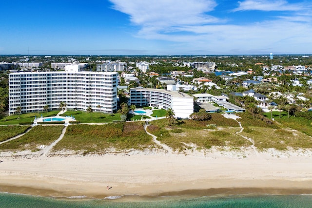 birds eye view of property featuring a view of the beach and a water view