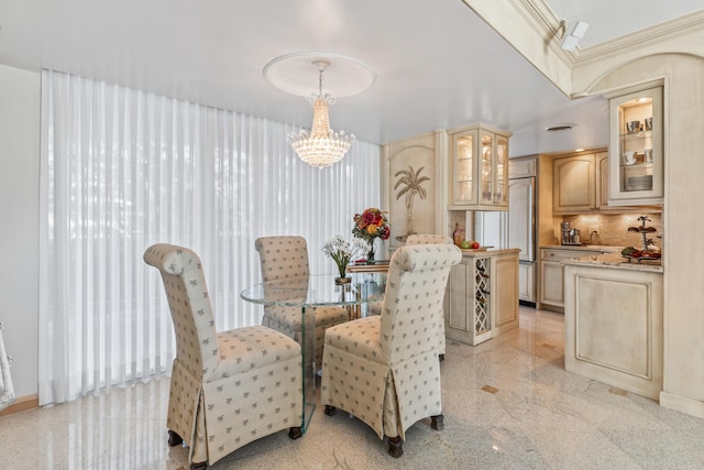 dining space featuring a notable chandelier and ornamental molding