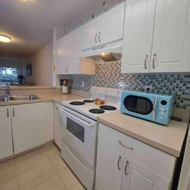 kitchen with white range with electric cooktop, sink, white cabinetry, tasteful backsplash, and light tile patterned floors