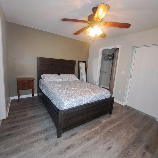 bedroom with ceiling fan and wood-type flooring