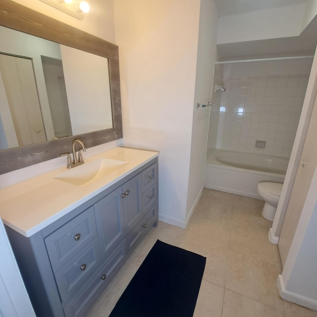 full bathroom featuring vanity, toilet, tile patterned floors, and tiled shower / bath combo