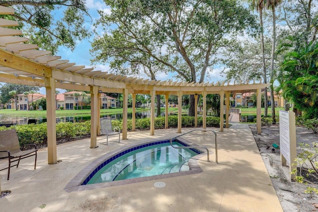 view of swimming pool with a pergola, a patio area, and a community hot tub