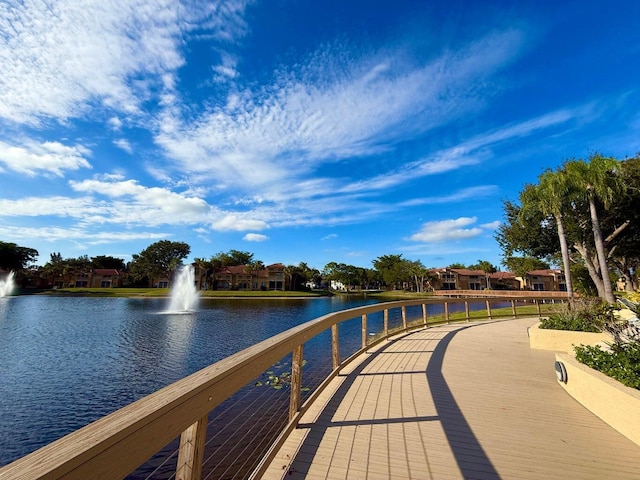 view of community with a water view