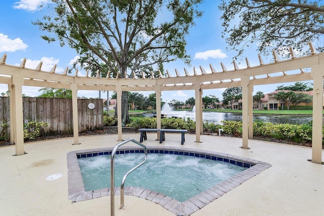 view of swimming pool featuring an in ground hot tub and a water view