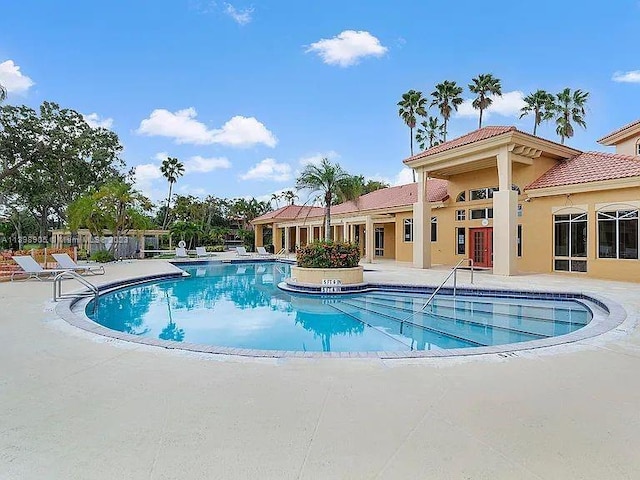 view of swimming pool with a patio