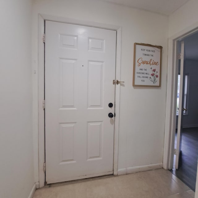 entryway featuring light tile patterned floors