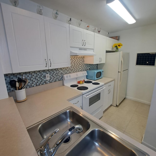 kitchen featuring white appliances, white cabinetry, sink, backsplash, and light tile patterned floors