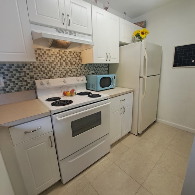 kitchen with white cabinetry, white appliances, light tile patterned floors, and tasteful backsplash