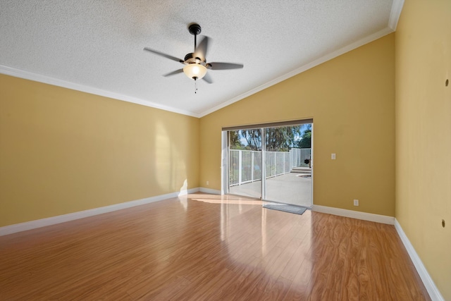 spare room with vaulted ceiling, ornamental molding, ceiling fan, a textured ceiling, and light hardwood / wood-style flooring