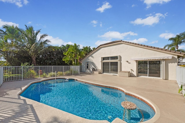 view of pool featuring a patio