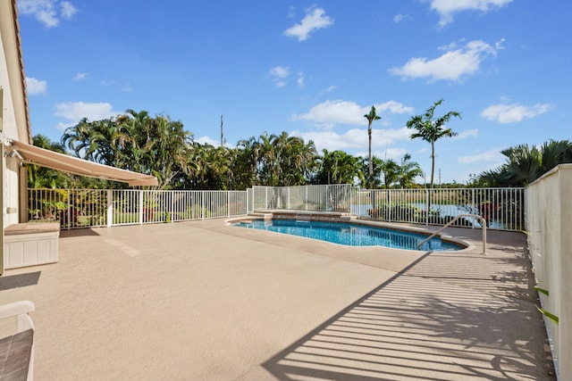 view of swimming pool featuring a patio area