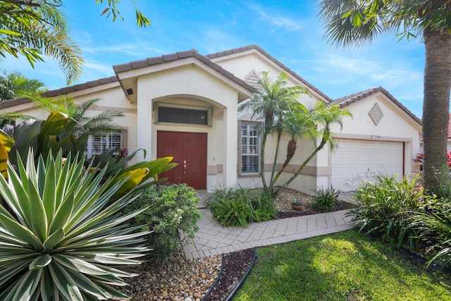 mediterranean / spanish-style house featuring a garage